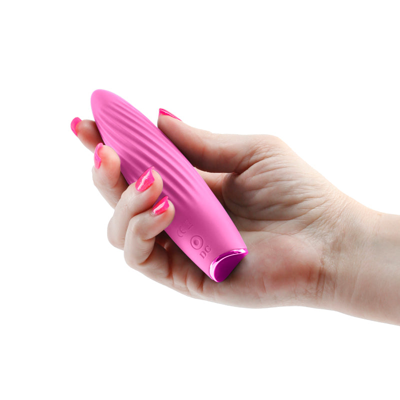 Revel Kismet -  -  11.8 cm USB Rechargeable Vibrator held in a hand, showcasing its sleek silicone design.