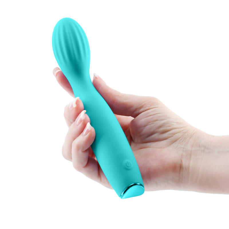 Revel Pixie - Teal - Teal 17.3 cm USB Rechargeable Vibrator held in hand, showcasing its flexible design and bulbous head.