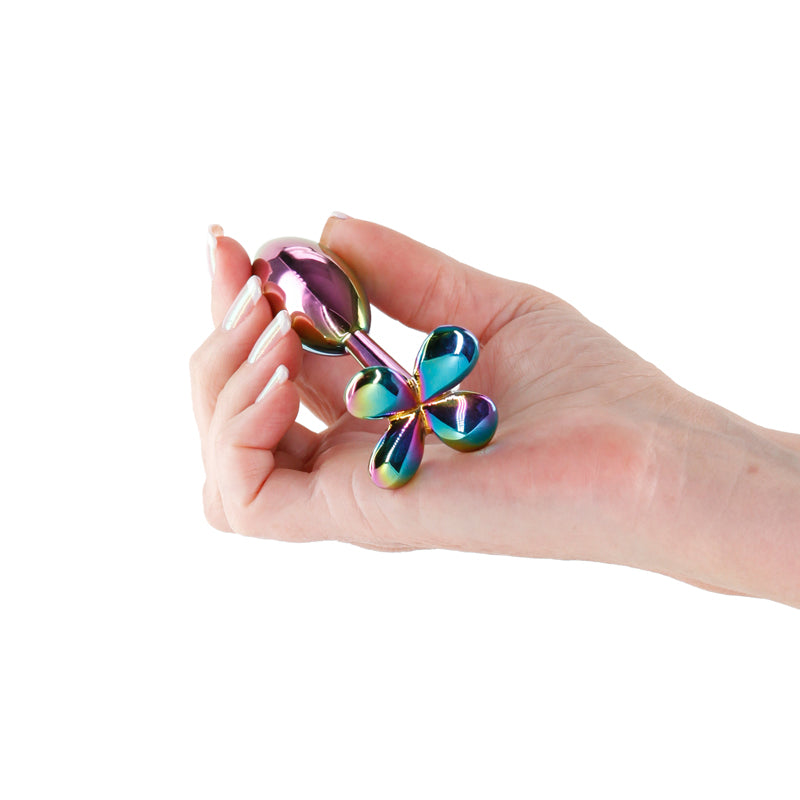 Rear Assets Clover - Multicolour - Multicoloured 9.2 cm Metallic Butt Plug held in a hand, showcasing its vibrant design.