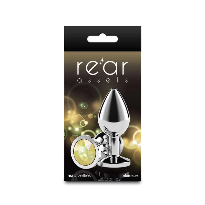 Rear Assets Silver medium aluminum butt plug with yellow gem base packaging for anal play.