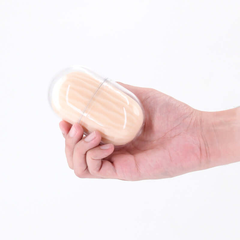 Portable mini stroker in hand, showcasing the compact design of Pocket Pals Lexi by NS Novelties.