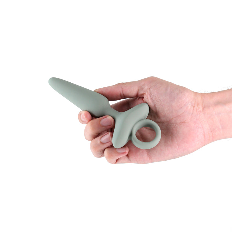 Renegade Maverick - Sage - 15 cm USB Rechargeable Vibrating Butt Plug held in hand, showcasing its sleek design.