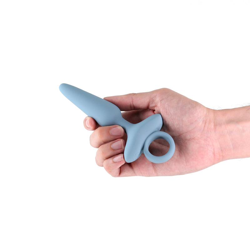 Renegade Maverick - Grey - Grey 15 cm USB Rechargeable Vibrating Butt Plug held in hand, showcasing design and functionality.