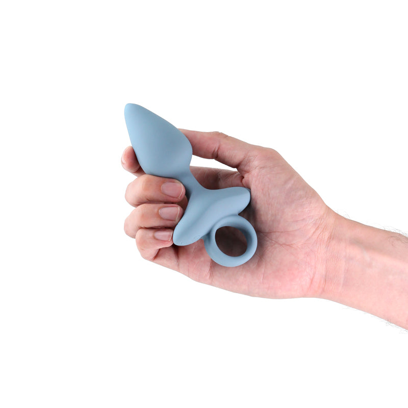 Renegade Orion - Grey - Grey 13 cm USB Rechargeable Vibrating Butt Plug held in hand.
