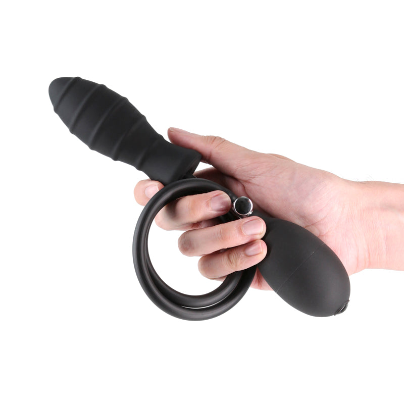 Renegade InflataPlay -  -  10.5 cm Inflatable Butt Plug held in hand, showcasing the pump and design features.