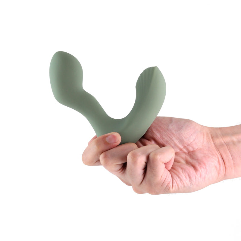 Renegade Outlaw sage rechargeable prostate massager held in hand, showcasing body-safe silicone and ergonomic design.