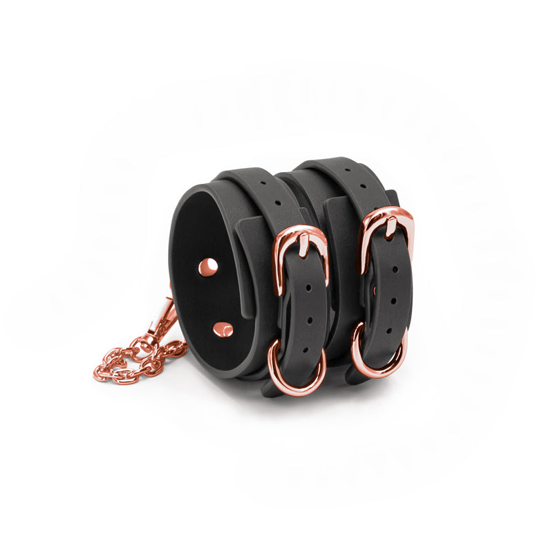 Bondage Couture Ankle Cuffs -  -  Restraints, black synthetic material with rose gold hardware for intimate essentials.