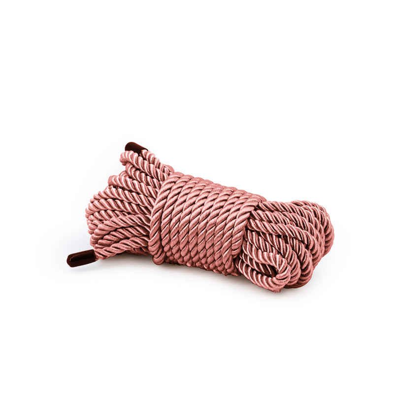 Bondage Couture Rope -  -  Bondage Rope - 7.6 metre, pink intimate accessory rolled neatly for adult entertainment.