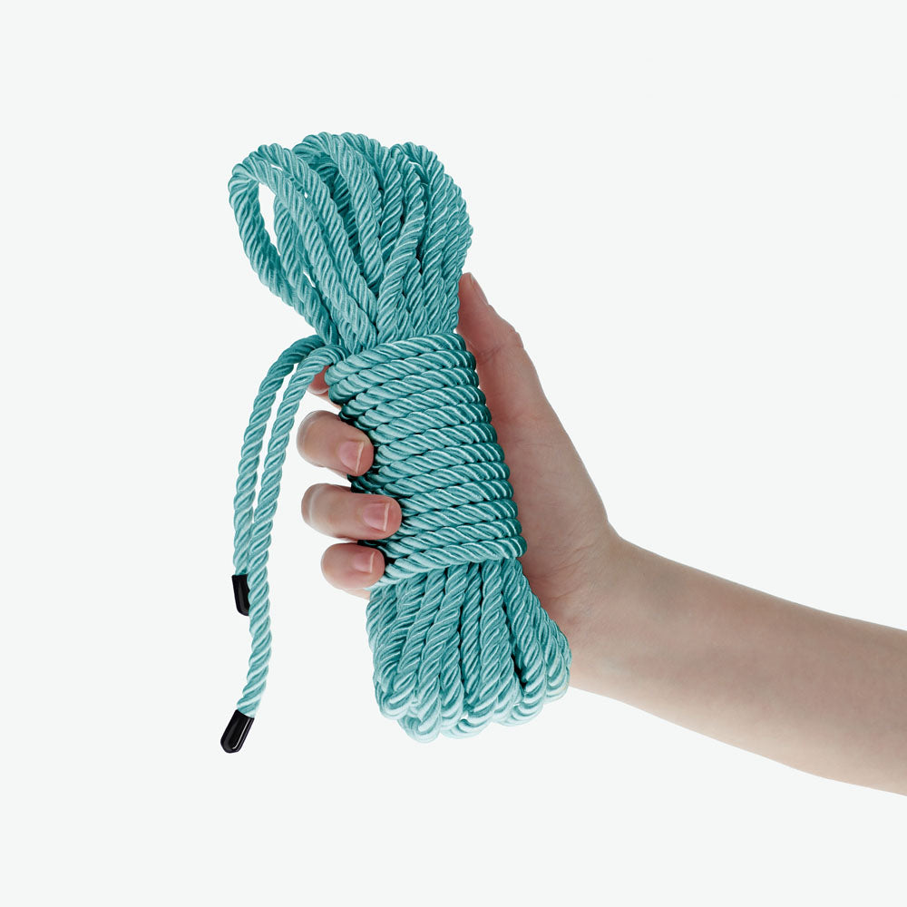 OUCH! Bondage Rope - 10 M -  -  Nylon Bondage Rope - 10 metre Length held in a hand.