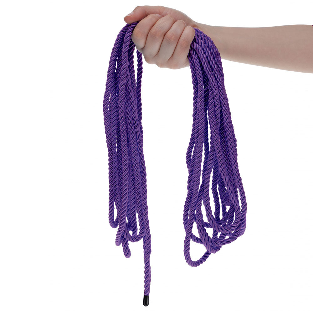 OUCH! Bondage Rope - 10 M -  -  Nylon Bondage Rope - 10 metre Length in purple color held by a hand.