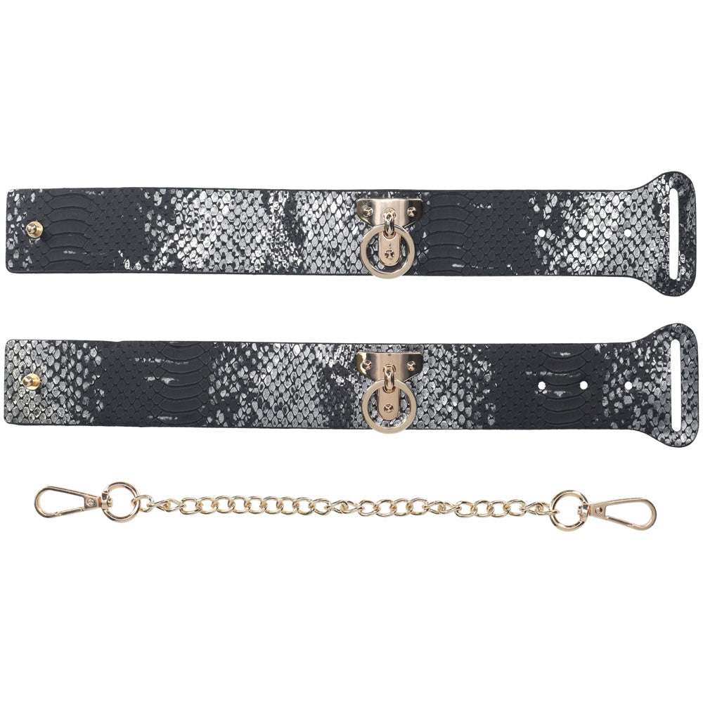 OUCH! Florence Collection - Handcuffs - Restraints featuring serpent-pattern bonded leather straps with metallic hardware.