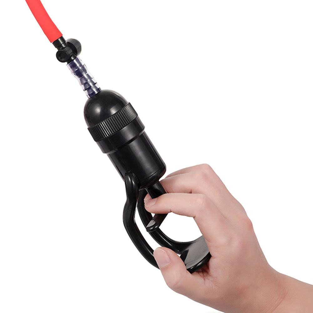 LuvPump Vagina Enhancement System - Clear/ Vagina Pump held in hand with red hose attached.