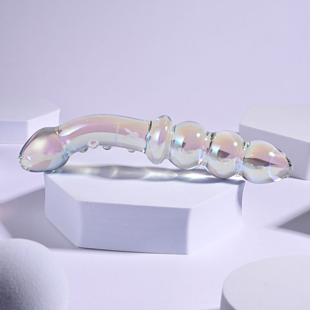 Playboy Pleasure JEWELS DOUBLE -  Glass 17.1 cm Double Ended Dildo displayed on geometric platforms.
