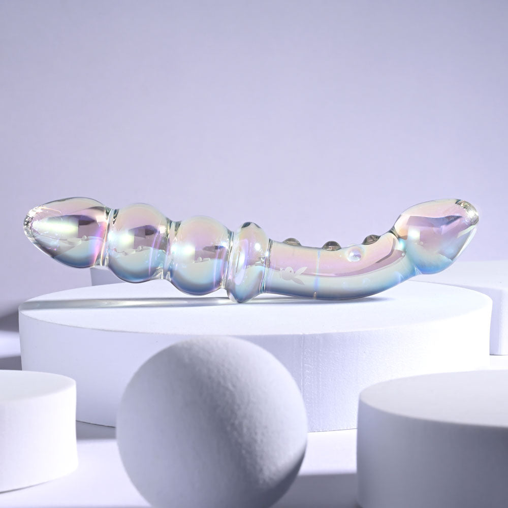 Playboy Pleasure JEWELS DOUBLE -  Glass 17.1 cm Double Ended Dildo displayed on a white podium, showcasing its unique design.