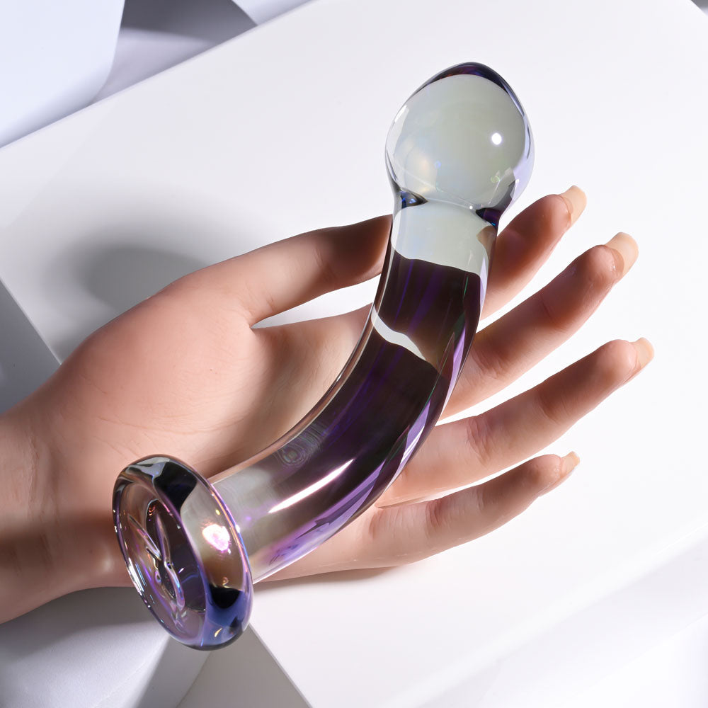Playboy Pleasure JEWELS KING -  Glass 16.3 cm Dildo held in hand, showcasing its smooth design and curved shape.
