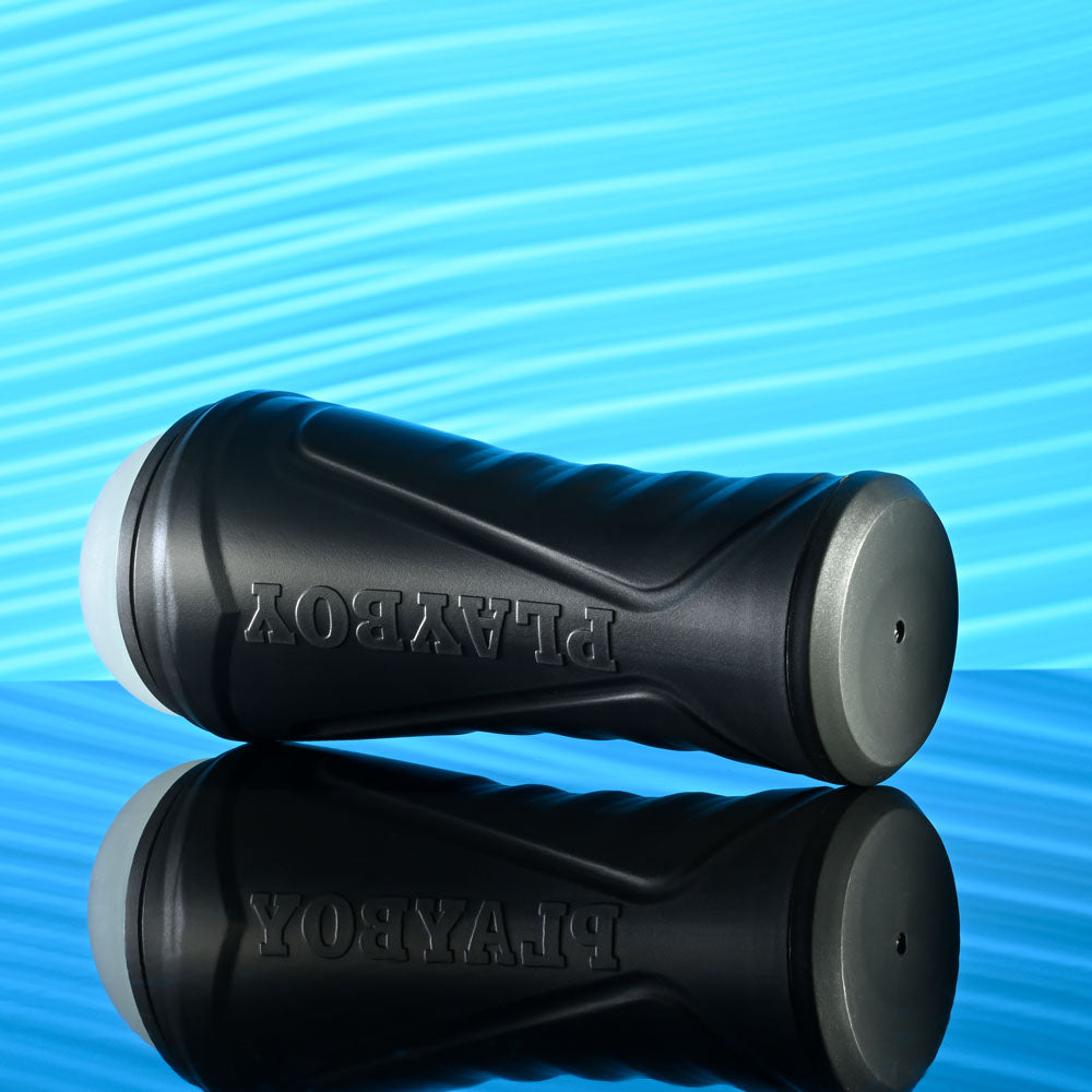 Playboy Pleasure THE URGE MEDIUM - Clear Stroker with textured grip on reflective surface.