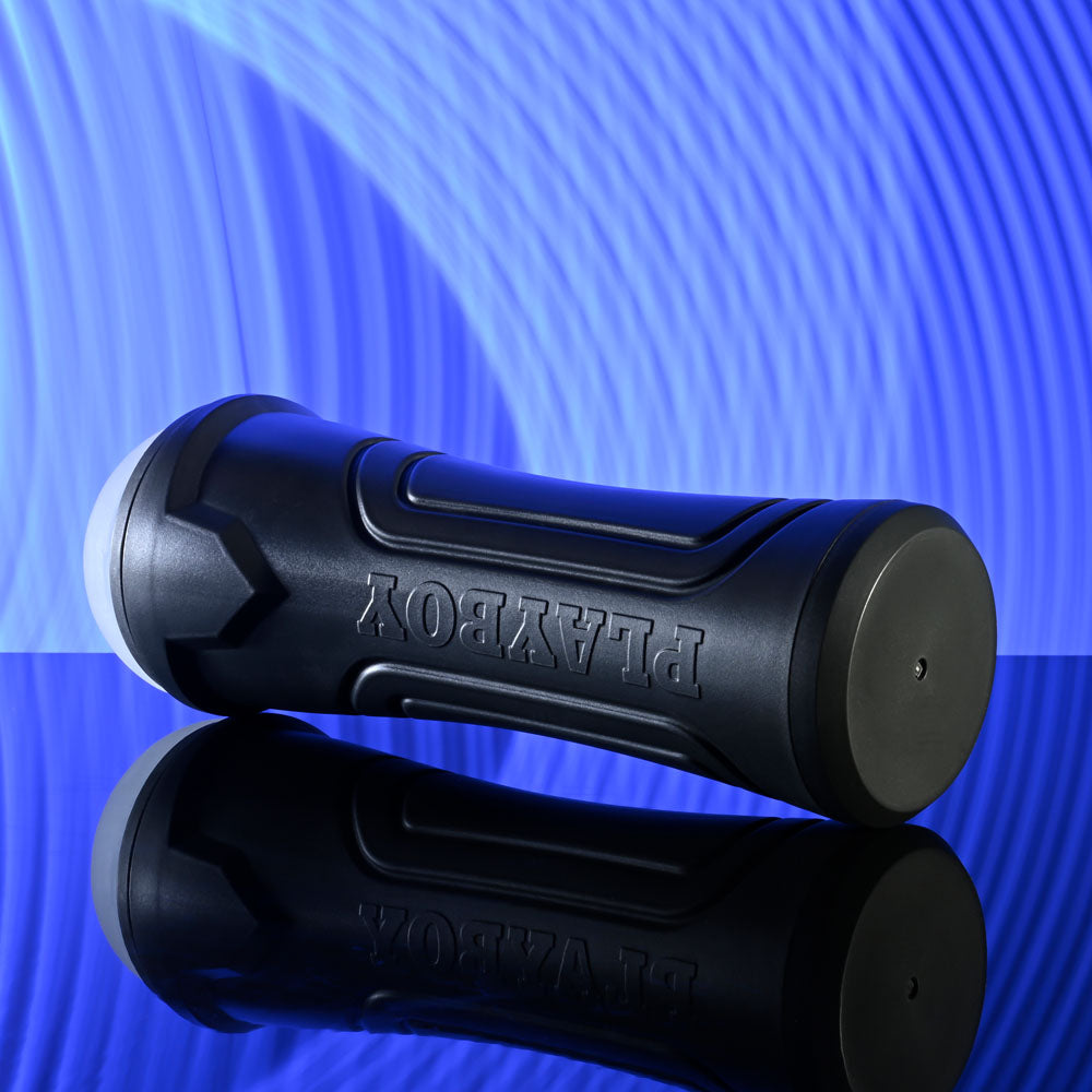 Playboy Pleasure THE URGE LARGE - Clear Stroker on reflective surface with blue background.