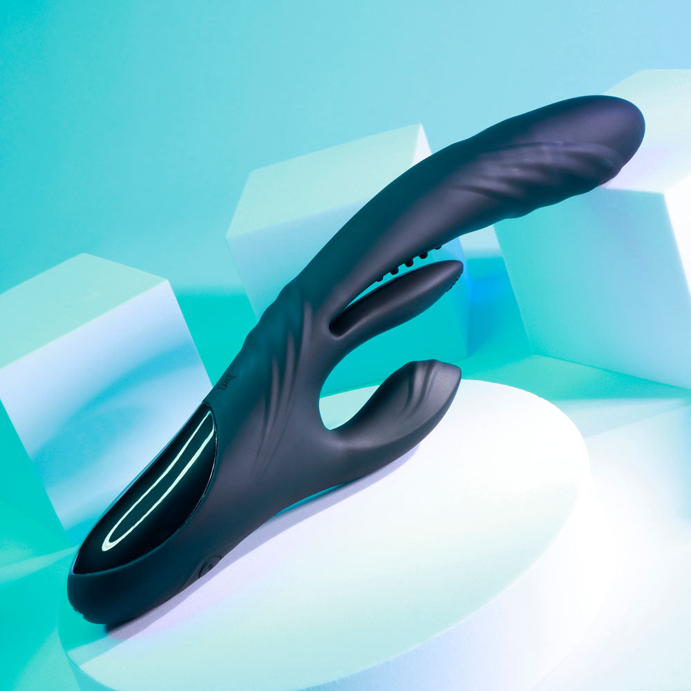 Playboy Pleasure RAPID RABBIT - 26.4 cm USB rechargeable rabbit vibrator showcasing its sleek design on a modern display.