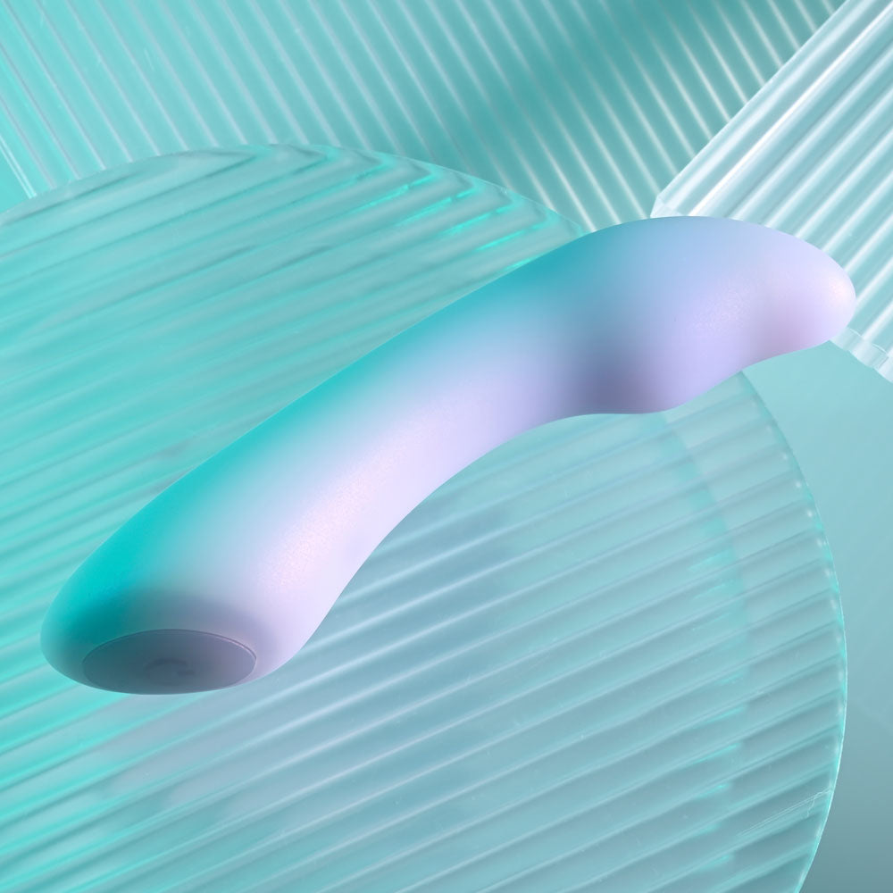 Playboy Pleasure EUPHORIA - Opal 12 cm USB Rechargeable Mini Vibrator on a textured background.