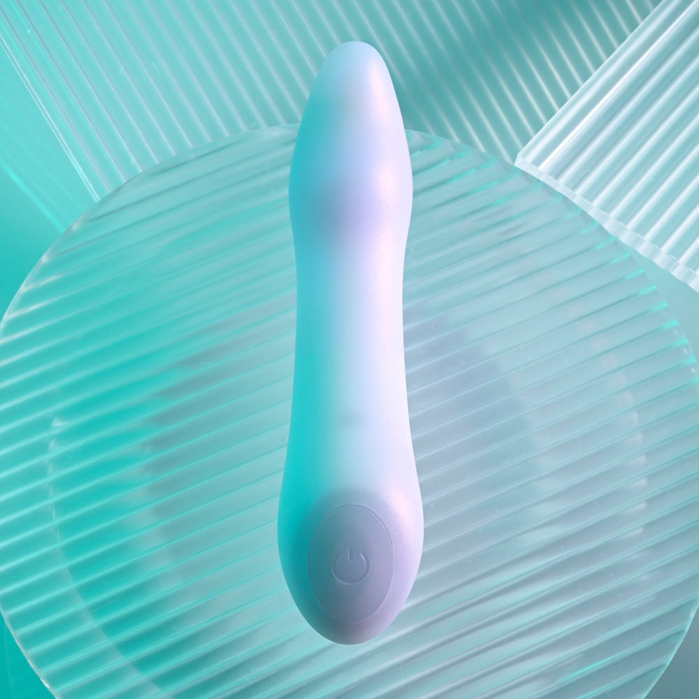 Playboy Pleasure EUPHORIA - Opal 12 cm USB Rechargeable Mini Vibrator on a textured surface.