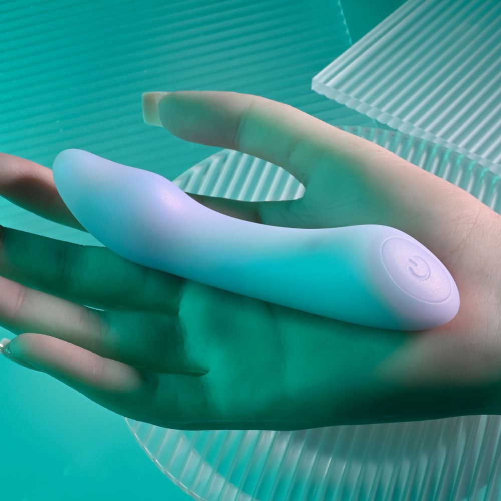 Playboy Pleasure EUPHORIA - Opal 12 cm USB Rechargeable Mini Vibrator in hand, showcasing its sleek design and smooth finish.
