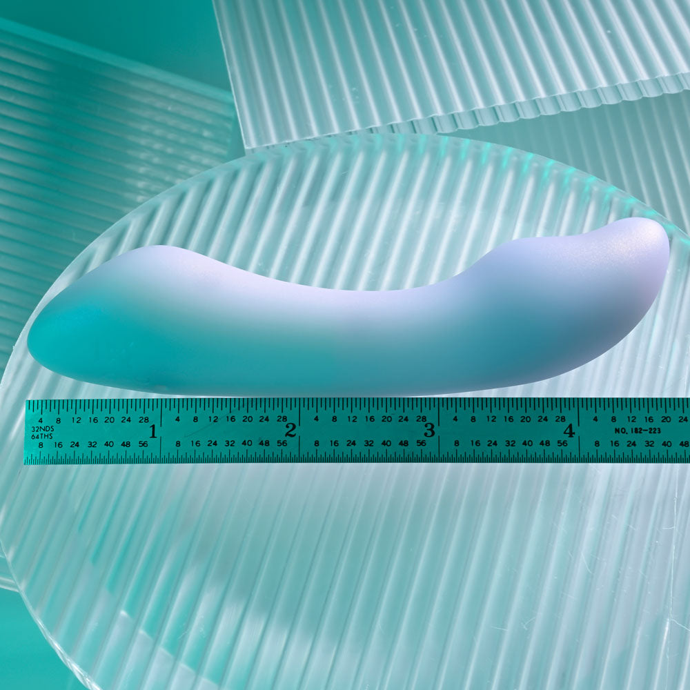 Playboy Pleasure EUPHORIA - Opal 12 cm USB Rechargeable Mini Vibrator on a textured surface with a ruler for size reference.