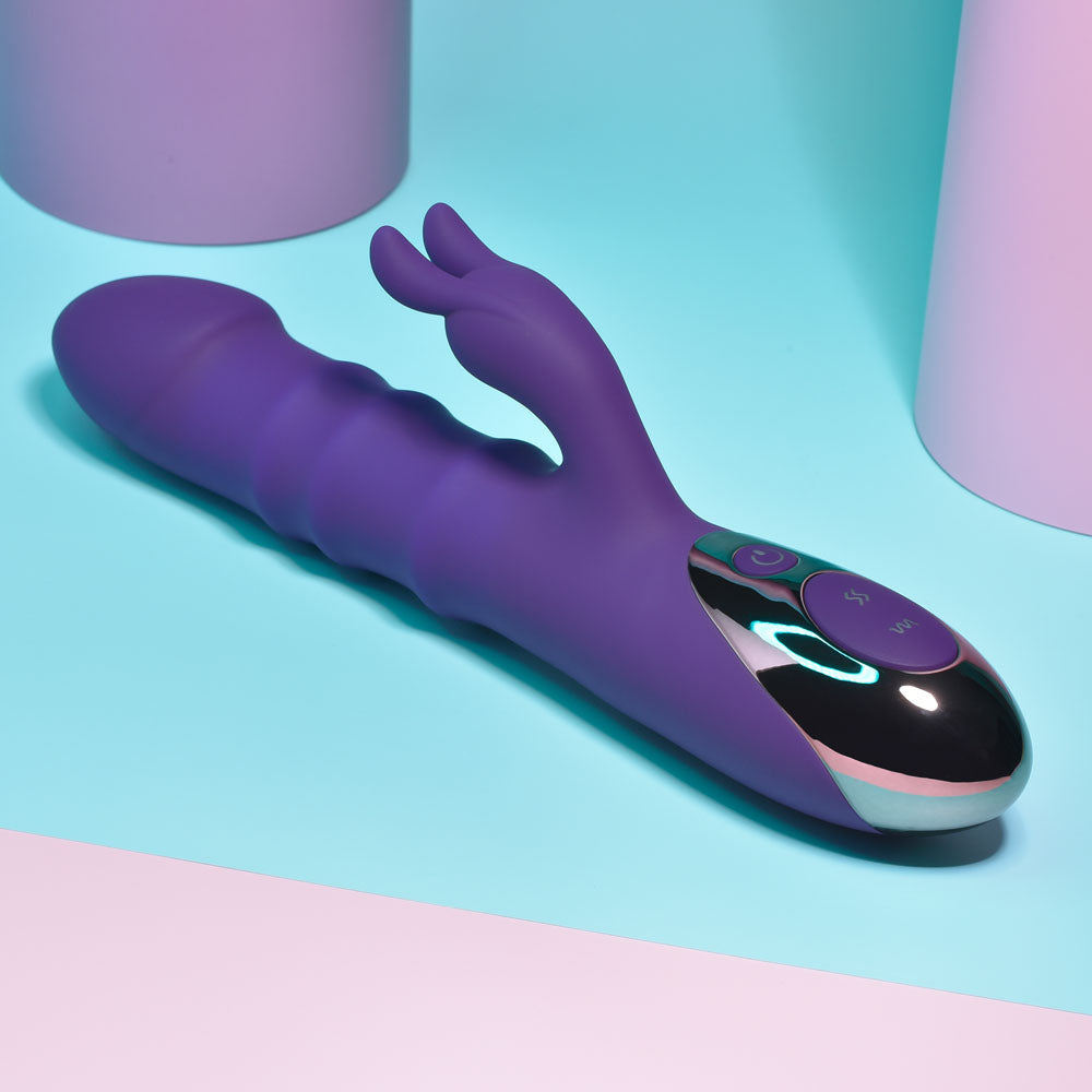 Playboy Pleasure HOP TO IT - 23.5 cm USB Rechargeable Rabbit Vibrator on a colorful surface, showcasing its sleek design.