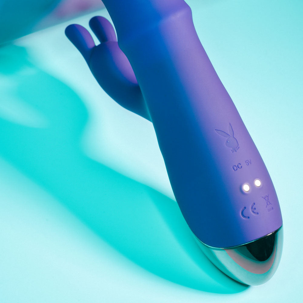 Playboy Pleasure HOP TO IT - 23.5 cm USB Rechargeable Rabbit Vibrator showing purple silicone design and control buttons.