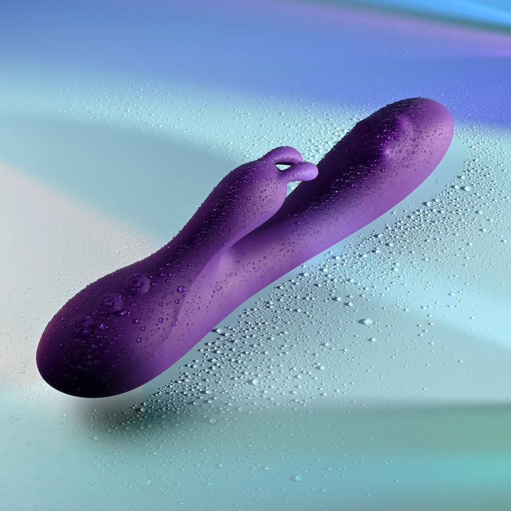 Playboy Pleasure ON REPEAT - 19.7 cm USB Rechargeable Rabbit Vibrator with a sleek purple design and textured surface.