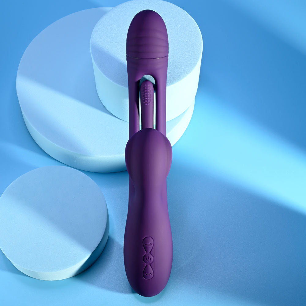 Playboy Pleasure THE THRILL - 24.4 cm USB Rechargeable Rabbit Vibrator on a blue background.
