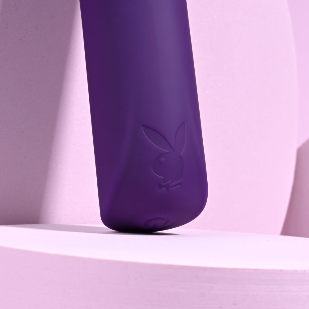 Playboy Pleasure ONE & ONLY - 12 cm USB Rechargeable Bullet against a soft pink background.