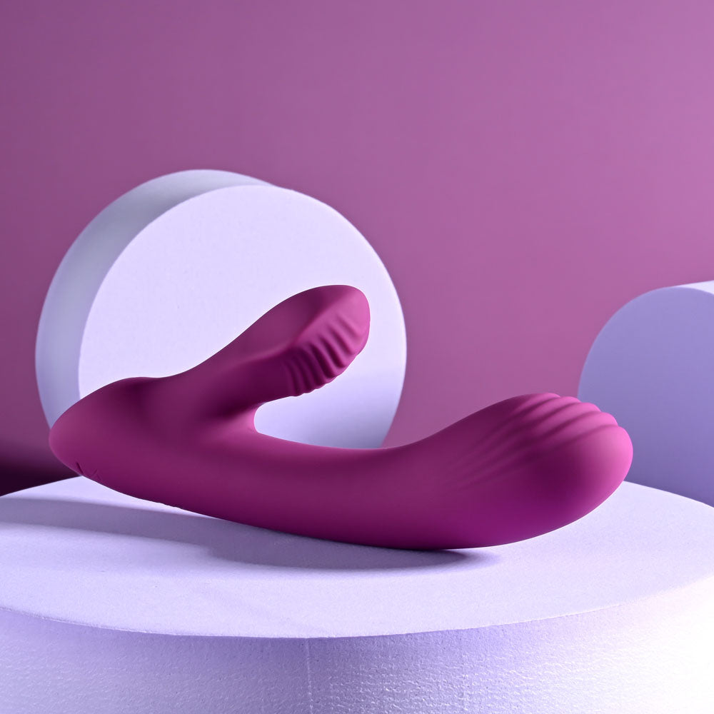 Playboy Pleasure Bitty Bunny - a pink USB rechargeable rabbit vibrator on display, designed for G-Spot and clitoral stimulation.