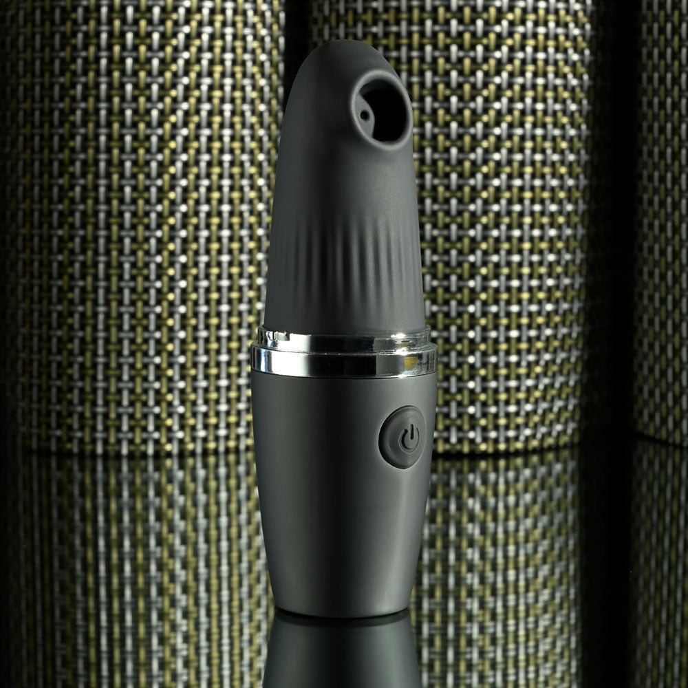Playboy Pleasure EXCURSION USB rechargeable suction stimulator in sleek black design with textured tip.