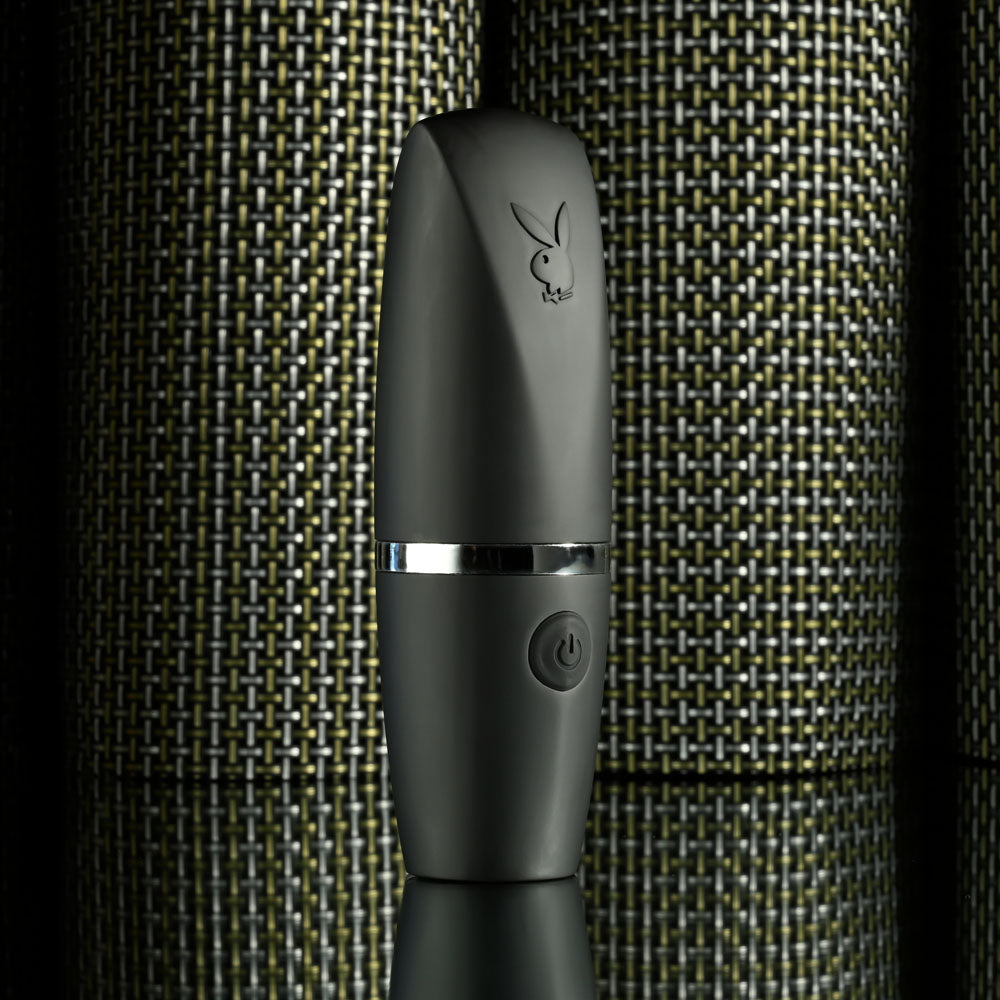 Playboy Pleasure EXCURSION -  14.2 cm USB Rechargeable Suction Stimulator on display, stylish and discreet design for intimate essentials.
