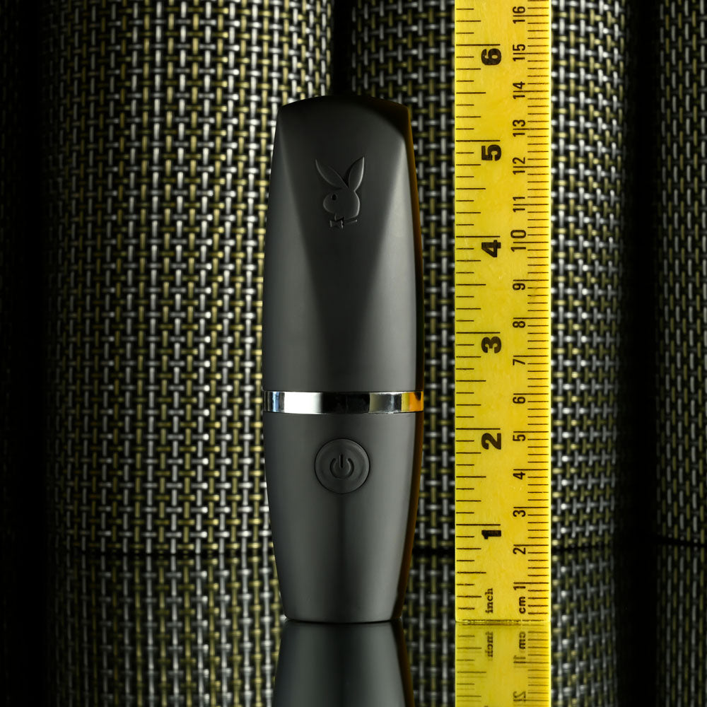 Playboy Pleasure EXCURSION -  14.2 cm USB Rechargeable Suction Stimulator with measuring tape for size reference.