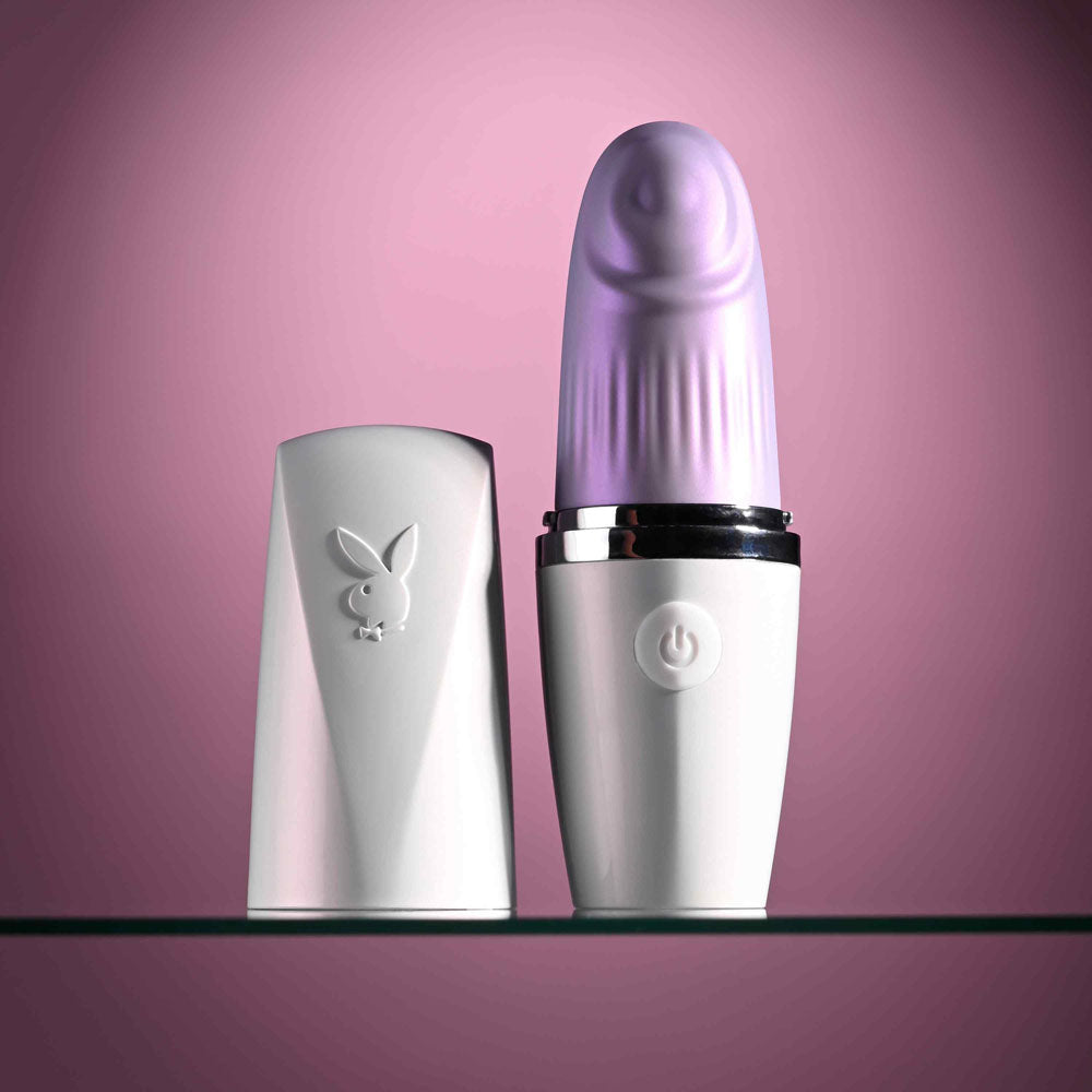 Playboy Pleasure GETAWAY - White/ 14.2 cm USB Rechargeable Tapping Stimulator on display.