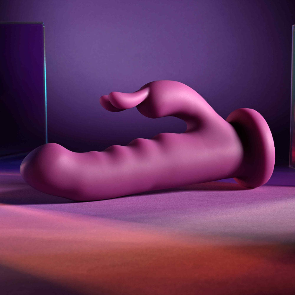 Playboy Pleasure FLUFFLE -  19.7 cm USB Rechargeable Rabbit Vibrator featured on a colorful background.