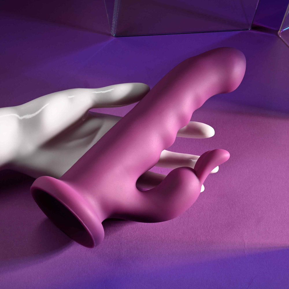 Playboy Pleasure FLUFFLE -  19.7 cm USB Rechargeable Rabbit Vibrator on a colorful surface.