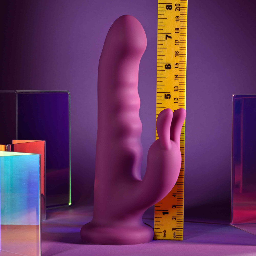 Playboy Pleasure FLUFFLE -  19.7 cm USB Rechargeable Rabbit Vibrator next to a measuring tape for size comparison.