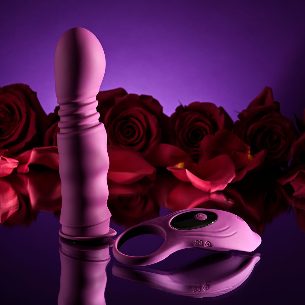 Playboy Pleasure MATCH PLAY -  USB Rechargeable with C-Ring Attachment surrounded by roses.