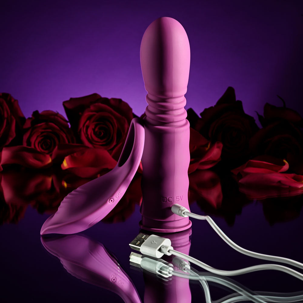 Playboy Pleasure MATCH PLAY - USB Rechargeable with C-Ring Attachment next to red roses.