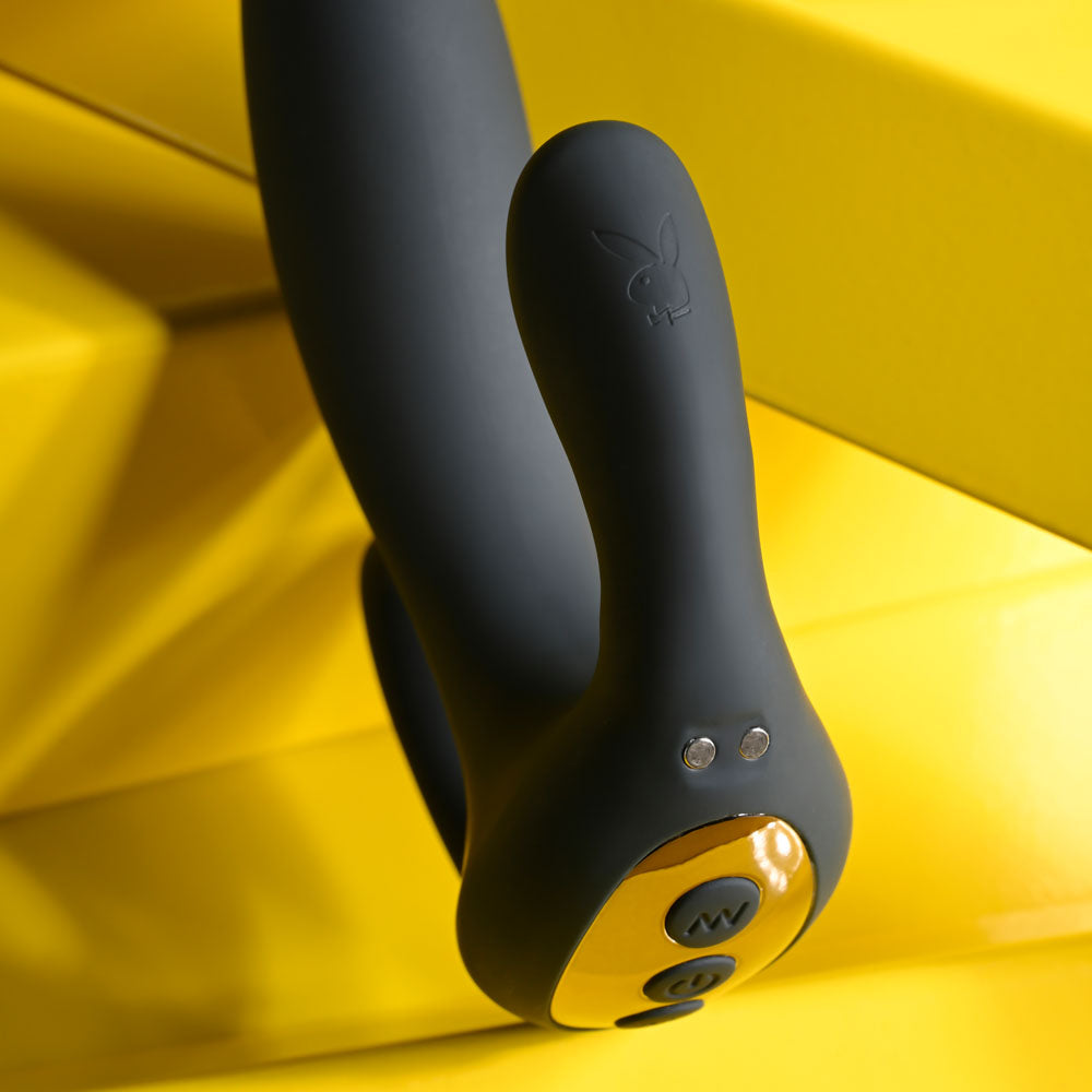 Playboy Pleasure TRIPLE THREAT - USB Rechargeable Triple Probe Vibrator close-up with controls, soft silicone against yellow background.
