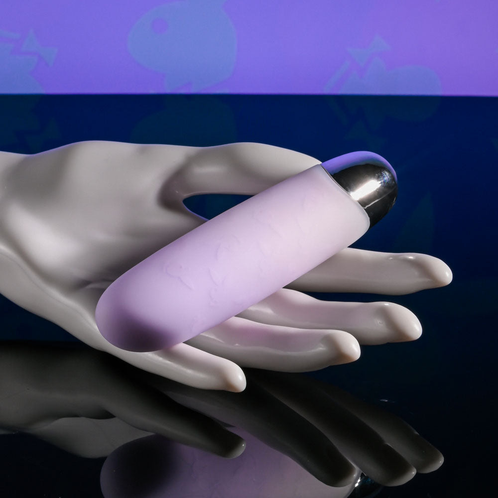 Playboy Pleasure BUNNY BUNCH - Pearl 11.3 cm USB Rechargeable Bullet in hand, showcasing luxurious design and soft texture.