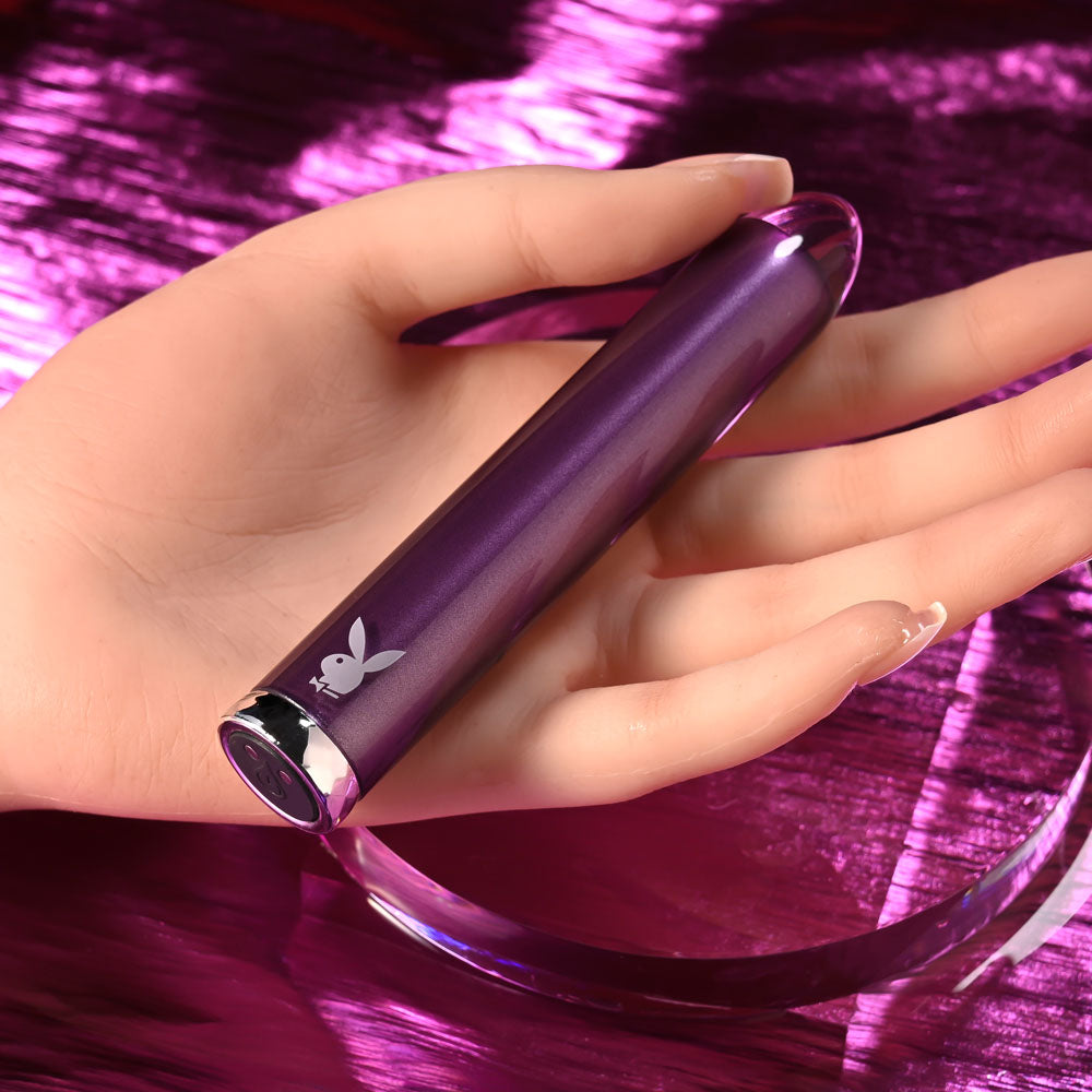 Playboy Pleasure AMETHYST - 12.4 cm USB Rechargeable Glass Tipped Mini Vibrator in hand, showcasing its sleek design.