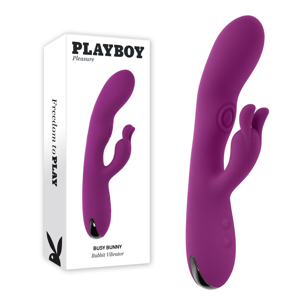 Playboy Pleasure BUSY BUNNY - 22.6 cm USB Rechargeable Rabbit Vibrator with Tapping Shaft on display.