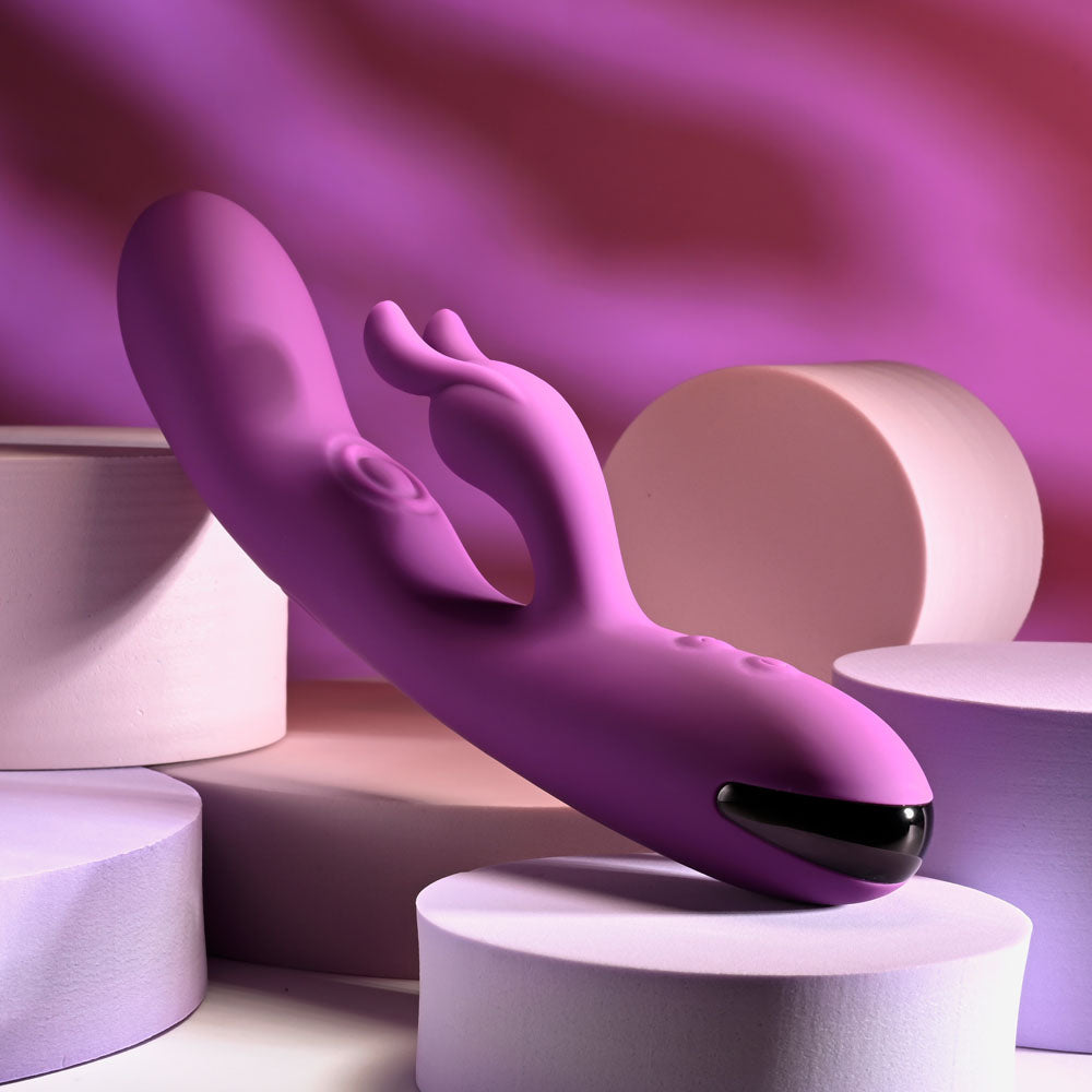Playboy Pleasure BUSY BUNNY - 22.6 cm USB Rechargeable Rabbit Vibrator with Tapping Shaft on pink background