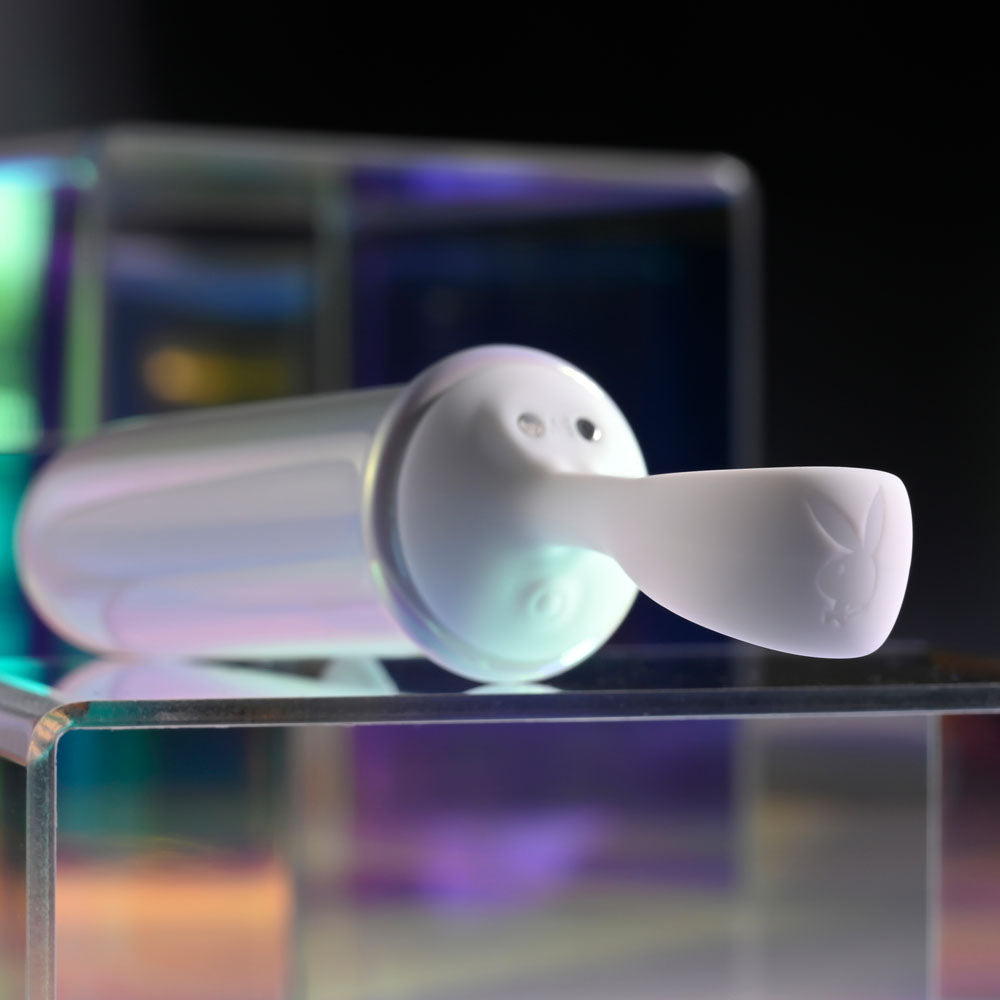 Playboy Pleasure ORGASMIC FANTASY - USB Rechargeable 13.5 cm Bullet on display with iridescent glow.