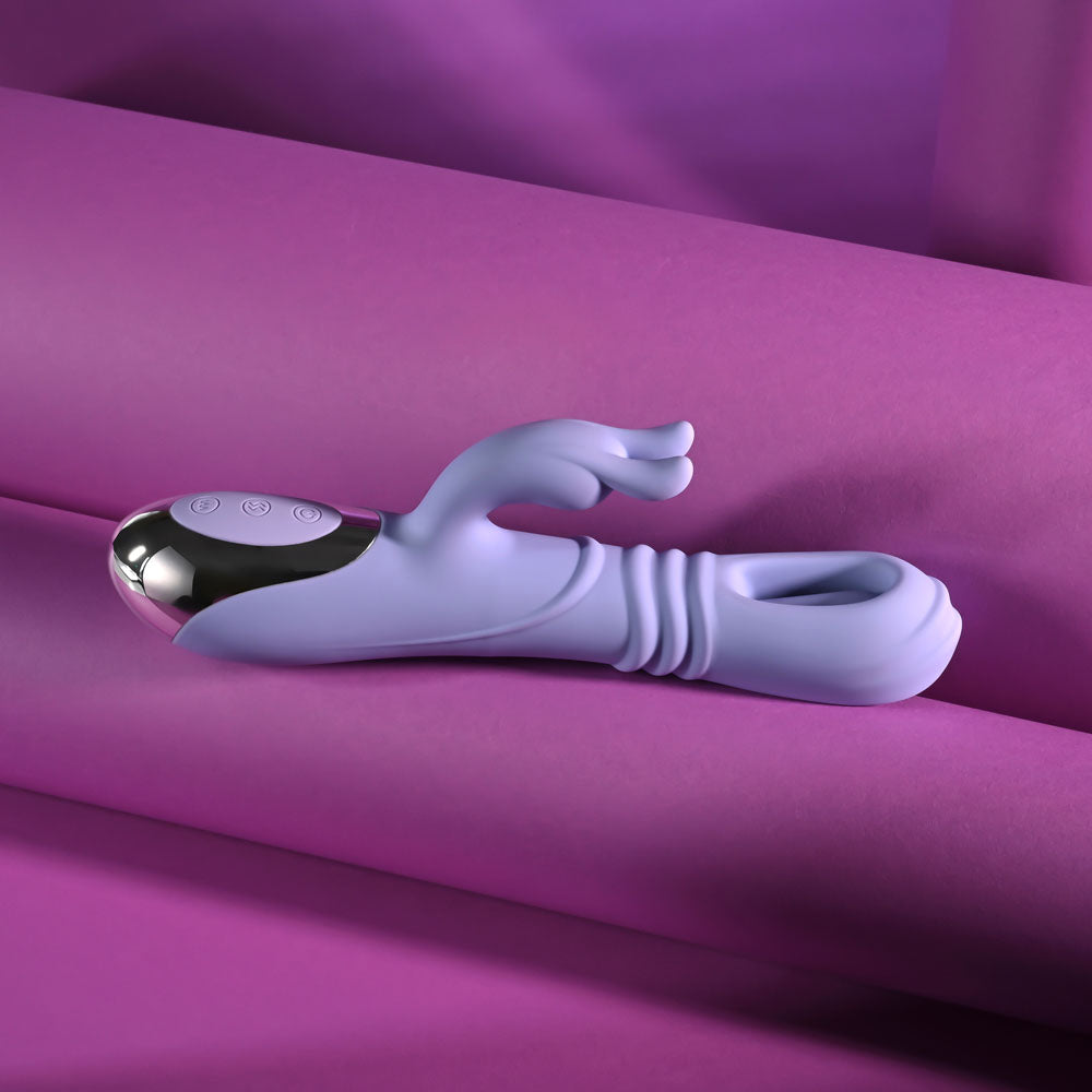 Playboy Pleasure TAP ME IN - 24.2 cm USB rechargeable rabbit vibrator on purple background.