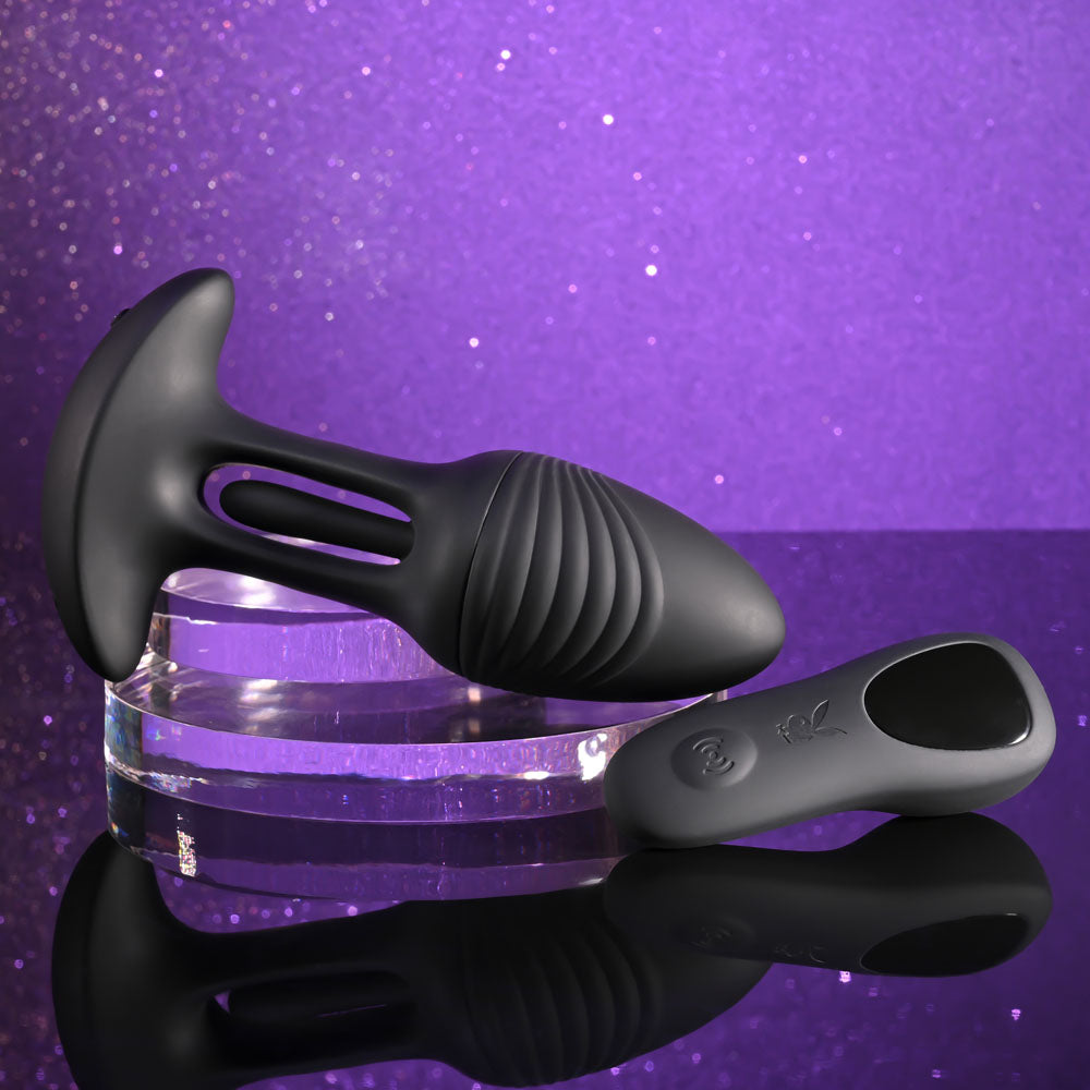 Playboy Pleasure RIM SHOT - 11.4 cm USB Rechargeable Vibrating Butt Plug on display with stylish background.
