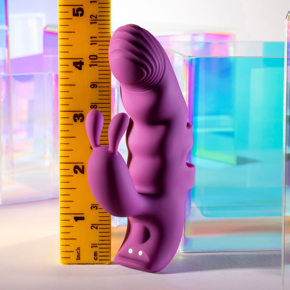 Playboy Pleasure LEND A HAND -  USB Rechargeable Finger Vibrator next to a ruler for size comparison.